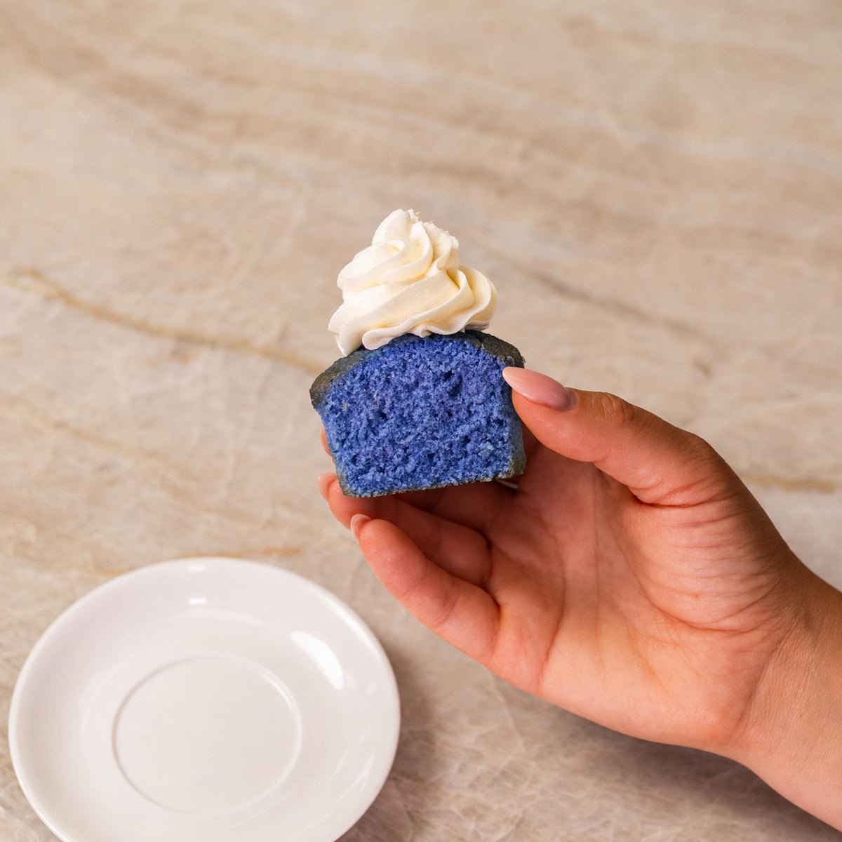 Blue cupcake made with natural food coloring powder.