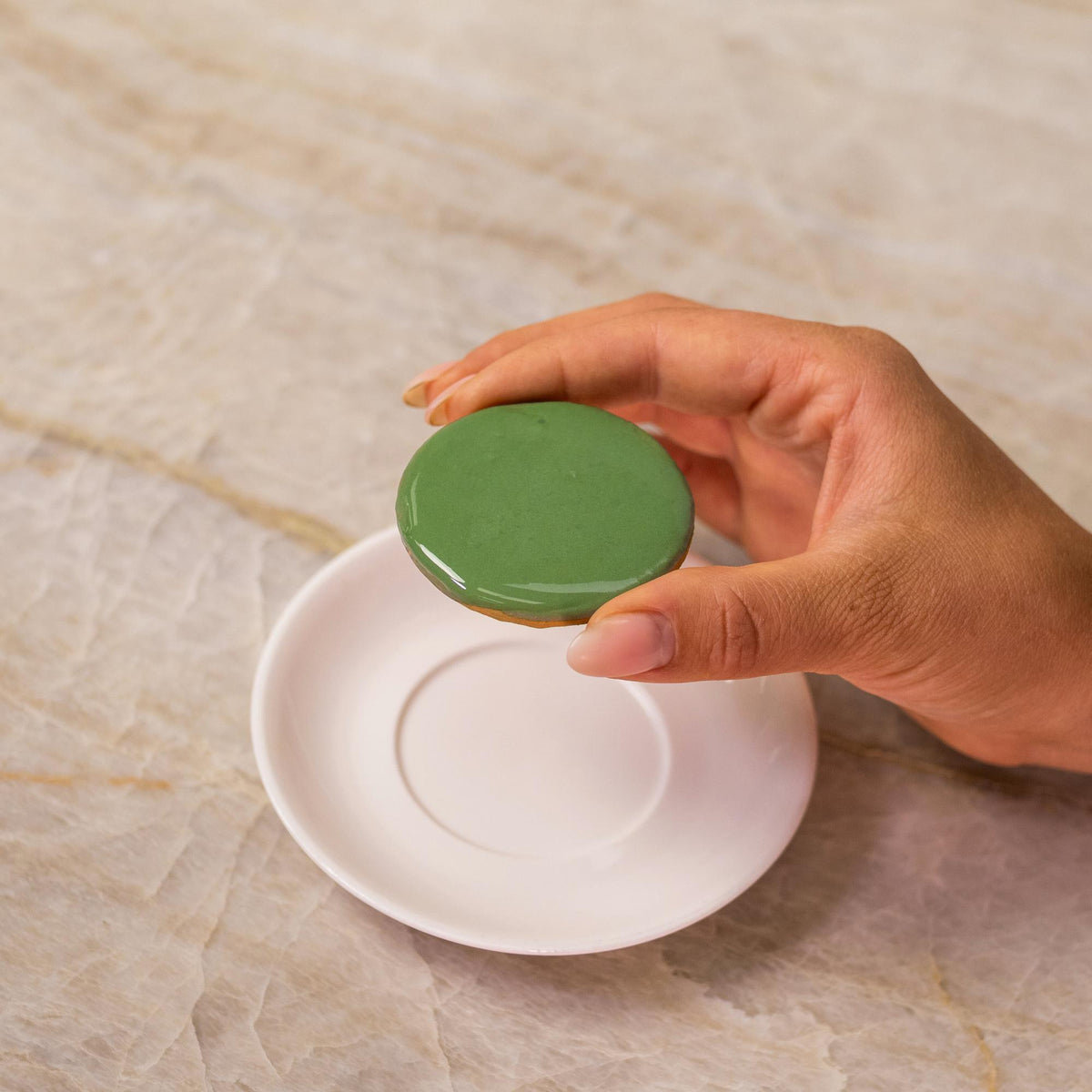 Green icing on cookie made with natural food coloring powder.