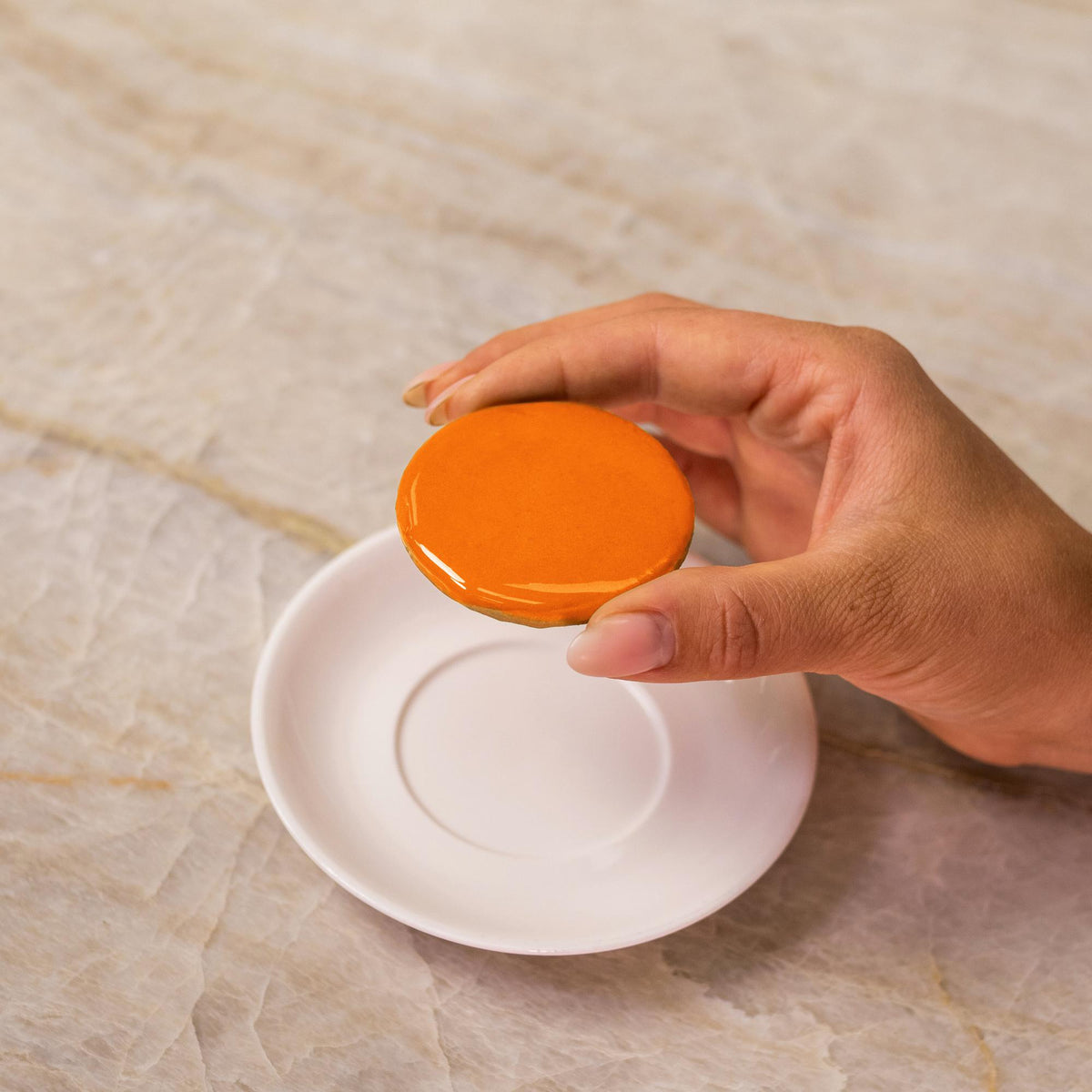 Orange icing on cookie made with natural food coloring powder.