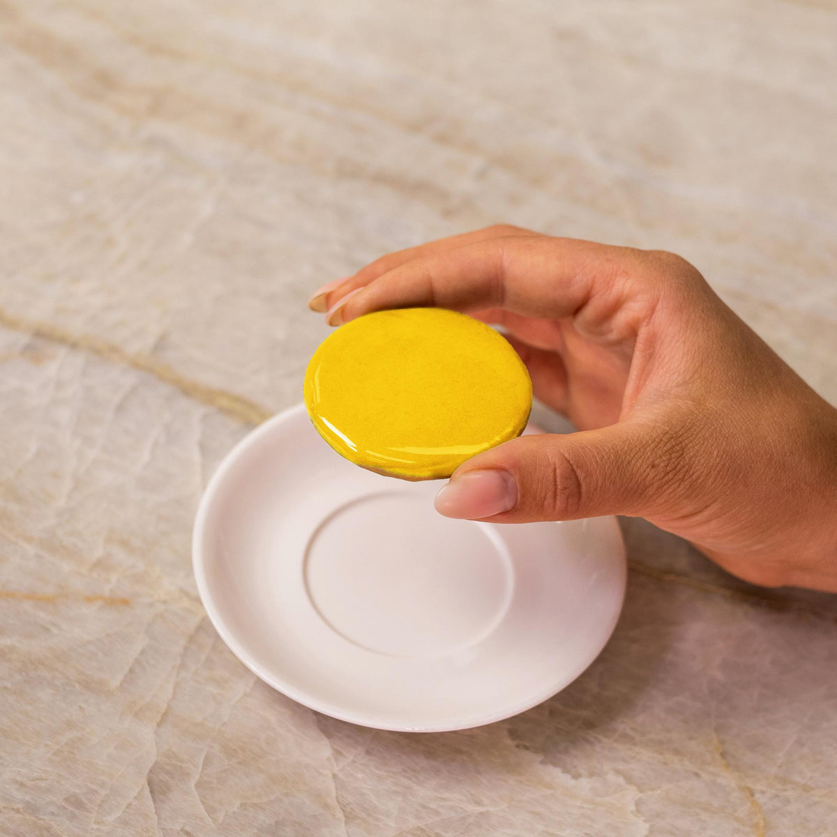 Yellow icing on cookie made with natural food coloring powder.