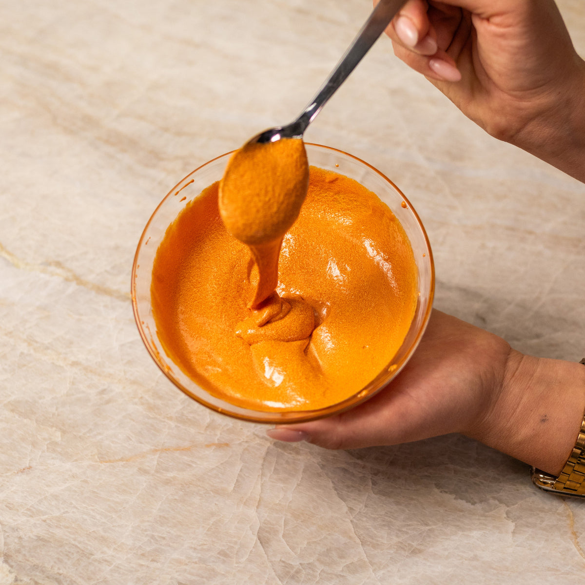 Finished orange cake batter made with ADAMA natural food coloring powder.
