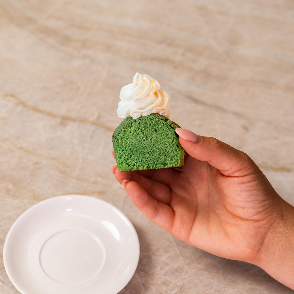 Green cupcake made with natural food coloring powder.