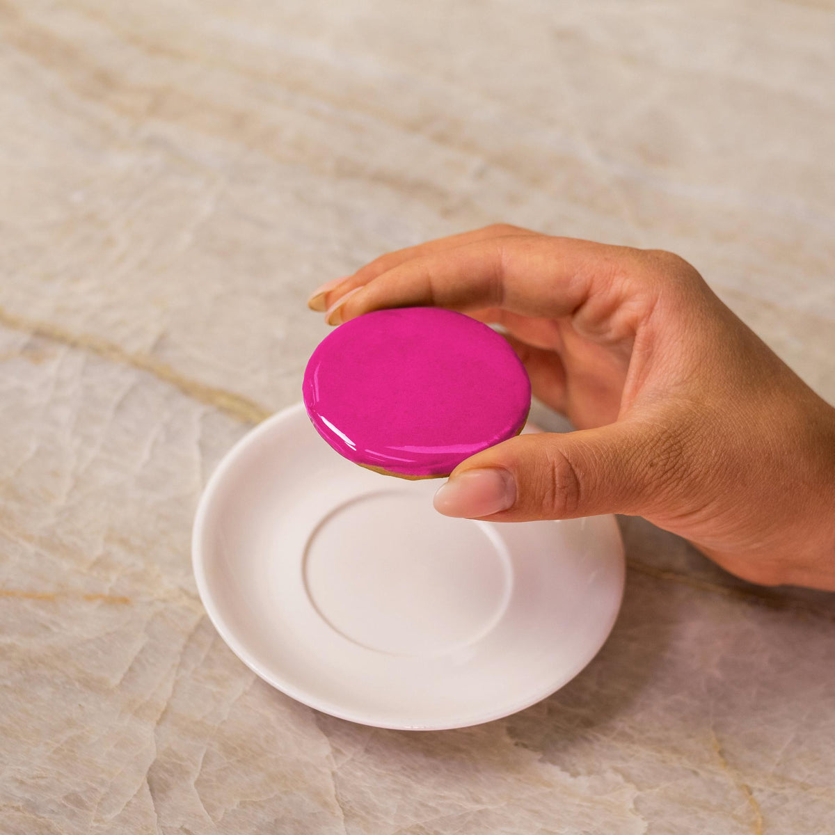 Pink icing on cookie made with natural food coloring powder.