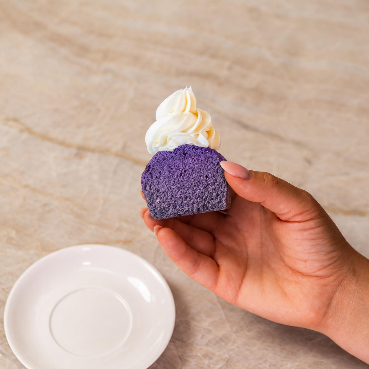 Purple cupcake made with natural food coloring powder.