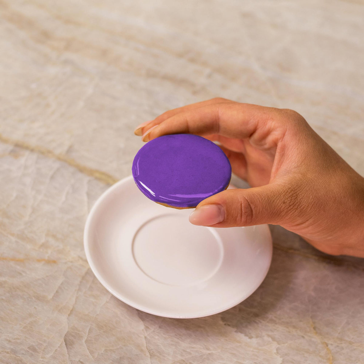 Purple icing on cookie made with natural food coloring powder.