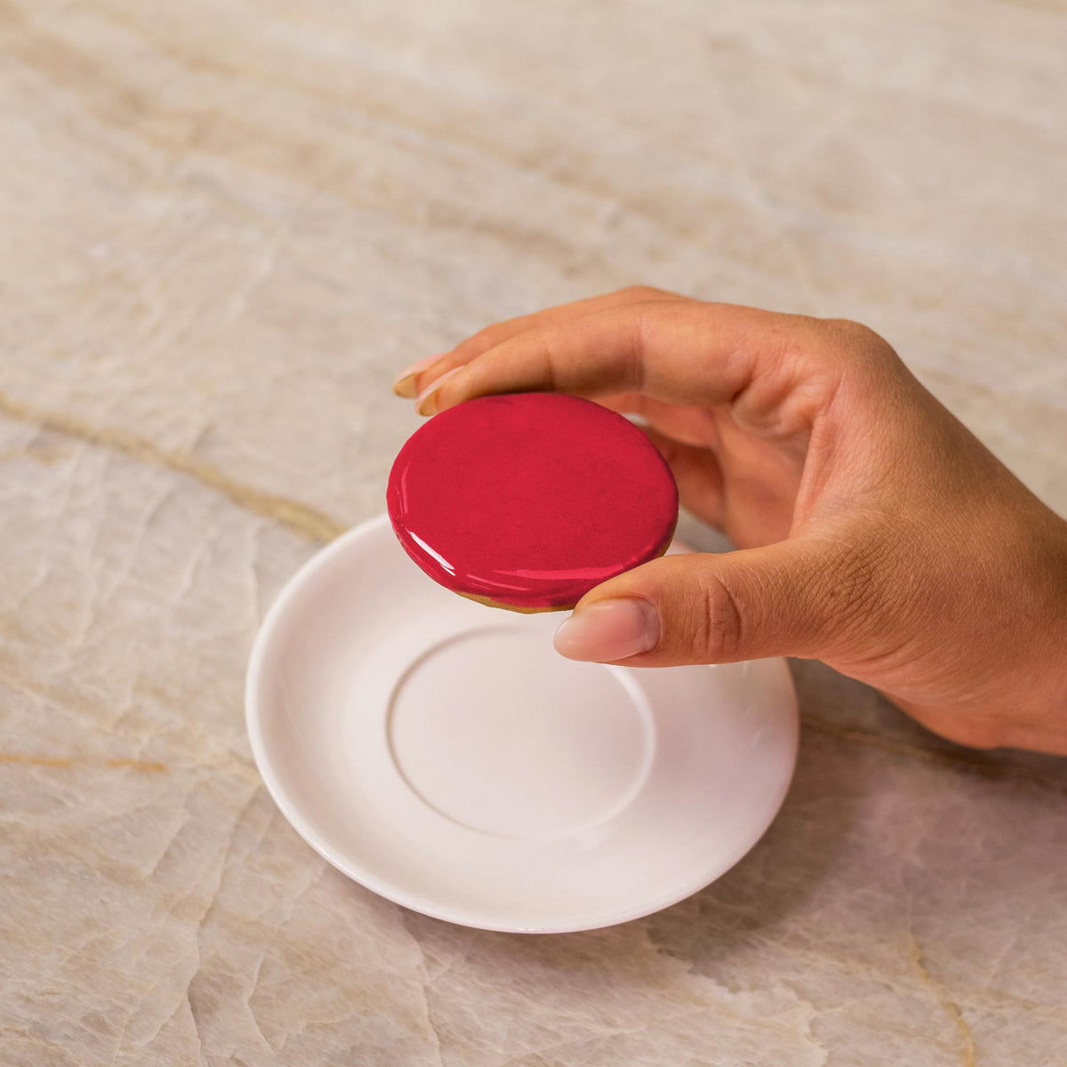 Red icing on cookie made with natural food coloring powder.
